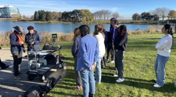 nate bartlett and students operating drone over lakefill lagoon